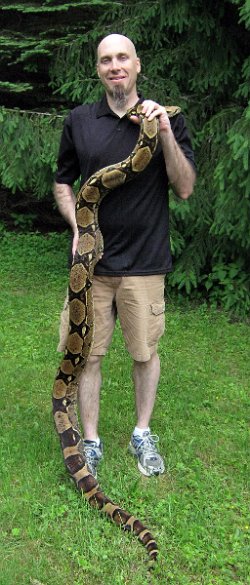 Picture of Samy and I taken on 5/29/11 (shade). I'm 6ft. 2in, so she is approximately 8 feet long.